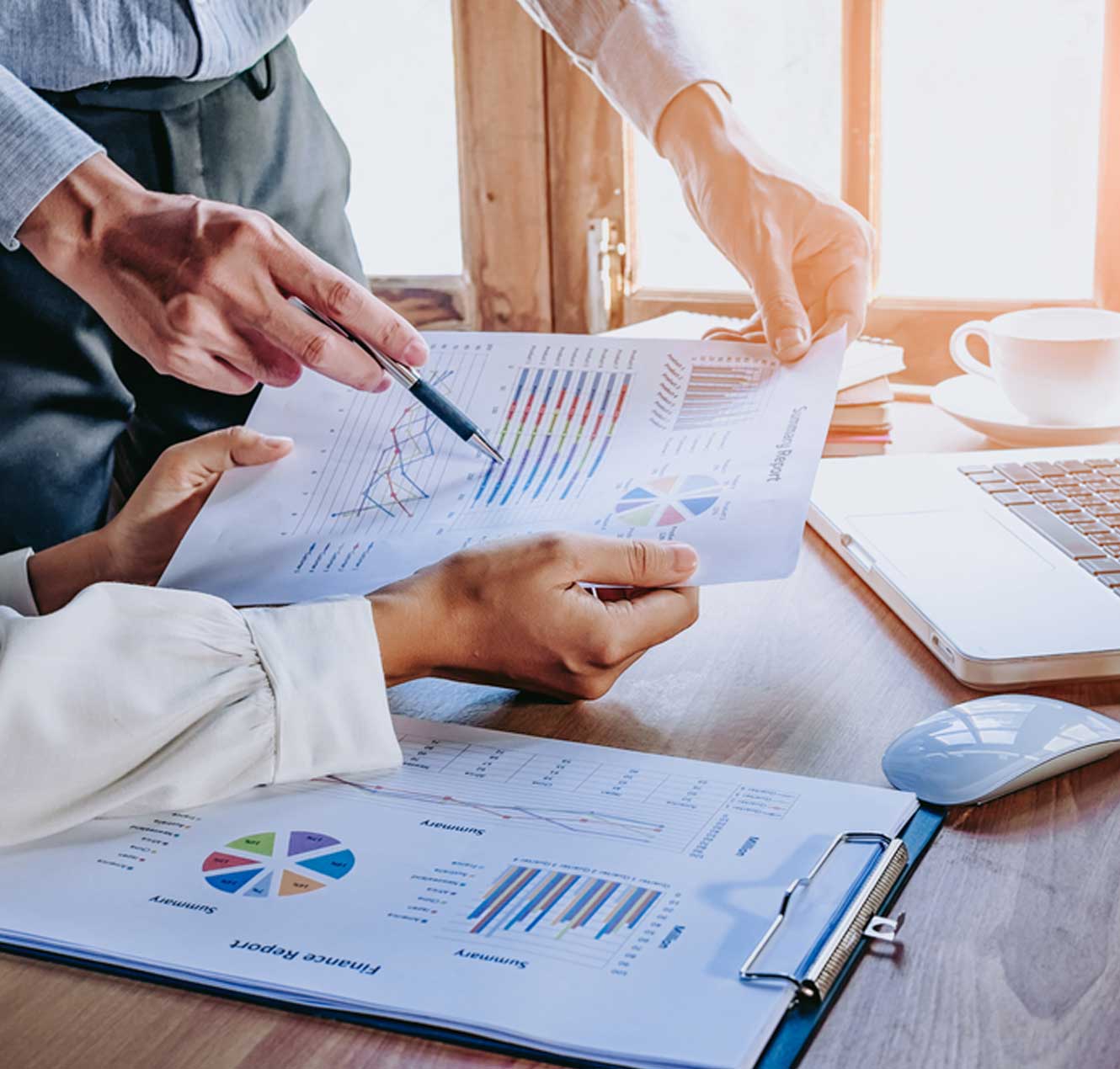 Hands Pointing to Paper Graphs